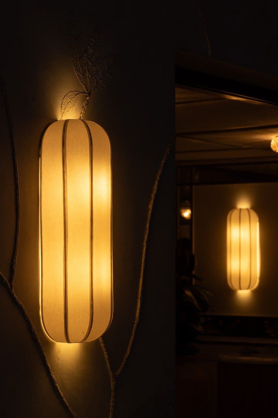 Arandela de tecido iluminada em parede escura